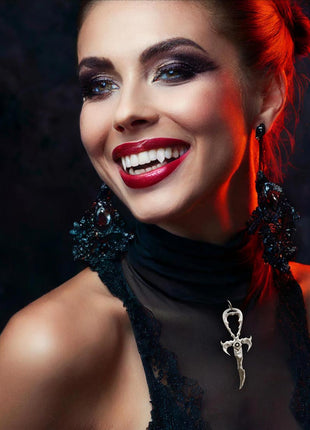 Ester is wearing the Los Angeles Vampire Ball Limited Edition 3rd Generation Legacy Ankh in Rhodium Protected Sterling Silver with Black Star Sapphire. She is wearing 3D printed Canine Classics fangs by Sabretooth fangs. Makeup by JoHanna Moresco.